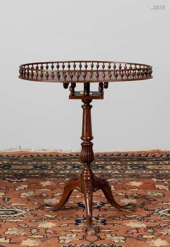 A rosewood gallery topped pedestal table. 28 1/2 x 16 x 24 i...