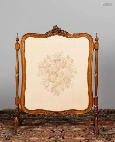 A Victorian walnut framed fire screen