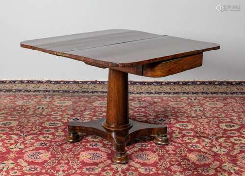 A 19th century rosewood foldover tea table, 28 x 38 x 18 3/4...