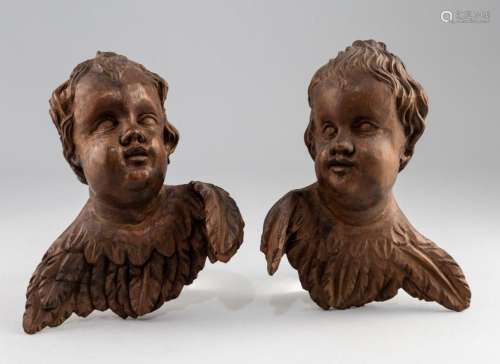 A pair of wall mounted carved wood cherubim. 8 in. (20.3 cm....