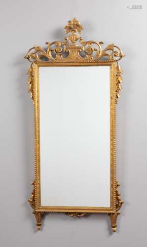A French carved and gilded console mirror. 57 x 27 in. (144....