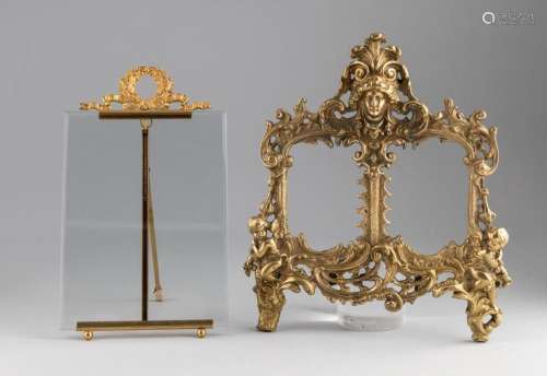 A gilt metal picture frame surmounted by a laurel wreath, 12...