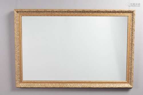 A large rectangular giltwood framed wall hanging mirror with...