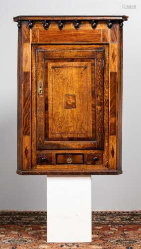 A late Georgian oak and mahogany corner cabinet. 35 x 30 x 4...