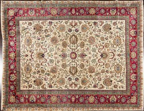 A Tabriz hand knotted wool rug, 9’11” x 12’10”