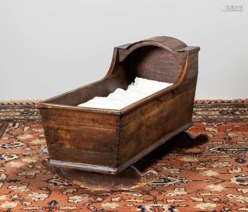 An 18th century oak rocking cradle. 21 1/2 x 37 1/2 x 16 in....