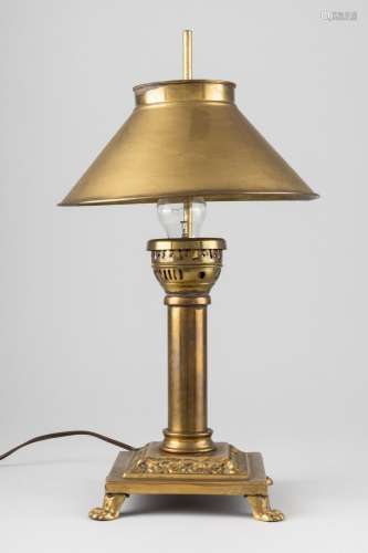 A brass table lamp with adjustable shade. 18 1/2 in. (47 cm....
