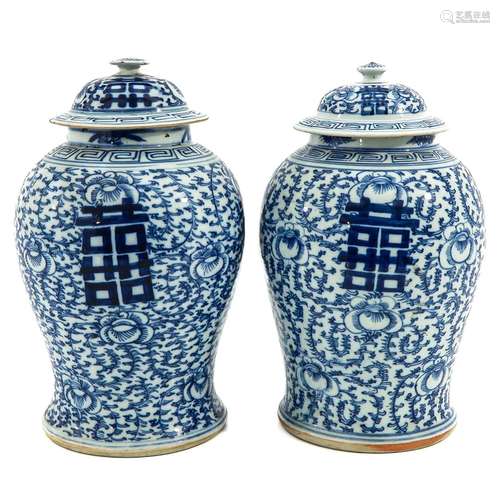 A Pair of Blue and White Pots with Covers