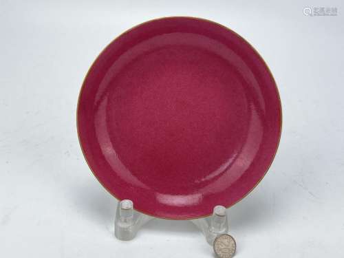 A Chinese red monochrome dish, Qing Dynasty Pr.