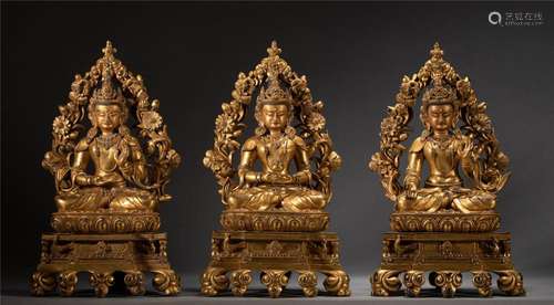 A SET OF THREE SINO-TIBETAN BRONZE-GILT THREE GREAT BUDDHAS ...