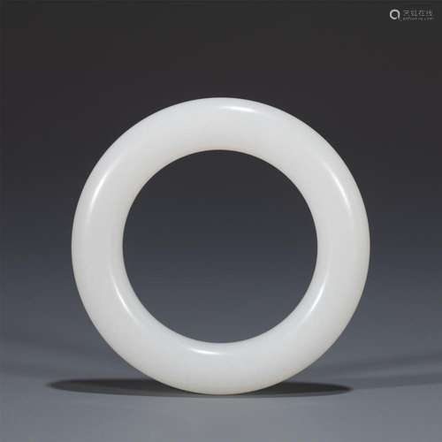 A CHINESE WHITE JADE CIRCULAR RING