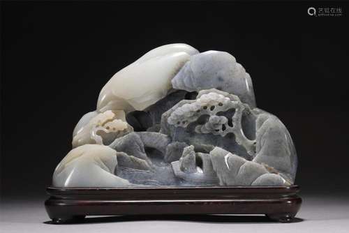 A CHINESE CARVED JADE BOULDER