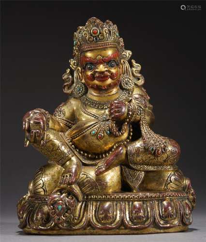 A TIBETAN BRONZE-GILT JAMBHLA