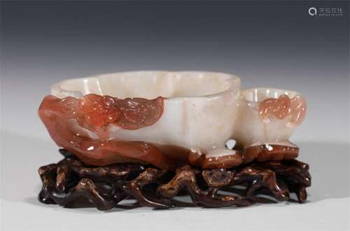 A CHINESE CARVED AGATE WASHER