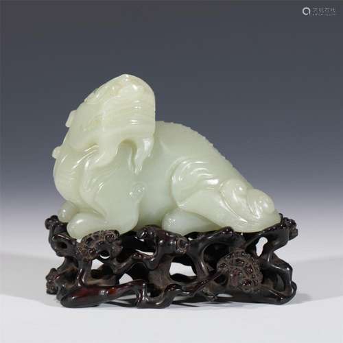 A CHINESE CARVED WHITE JADE MYTHICAL BEAST HOU