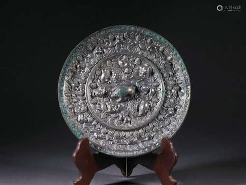 A Bronze Beasts and Grapefruits Circular Mirror