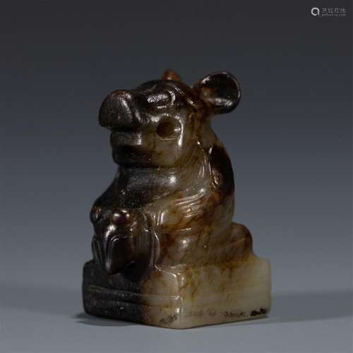 A CHINESE CARVED JADE MYTHICAL BEAST