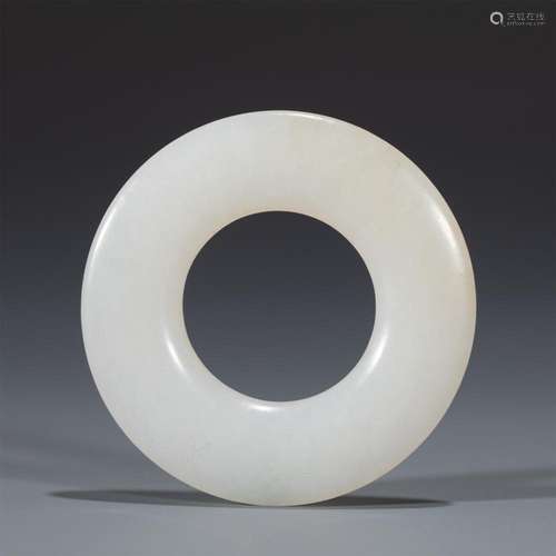 A CHINESE WHITE JADE CIRCULAR RING