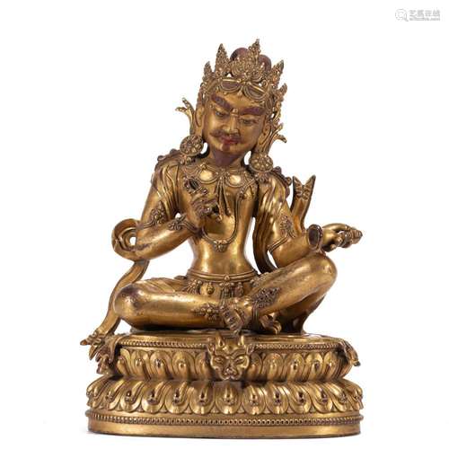 A TIBETAN BRONZE-GILT SIDDHA