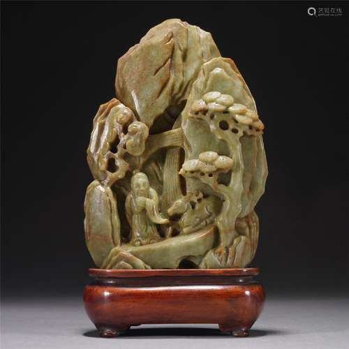 A CHINESE CARVED JADEITE BOULDER