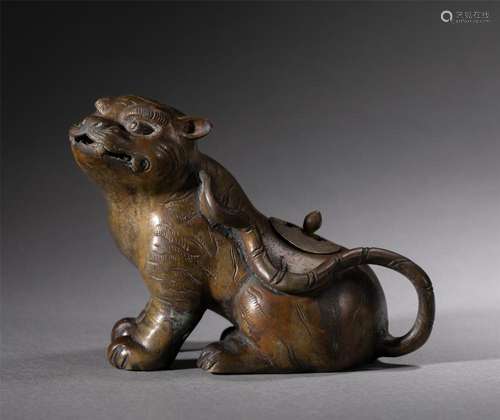 A CHINESE BRONZE FELINE