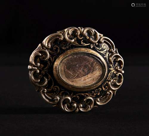 A BROOCH CONTAINING LOCKETS OF HAIR, DATED 1851, PROBABLY MU...