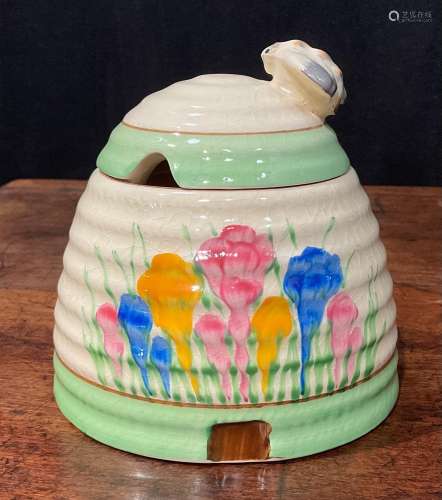 A Clarice Cliff Spring Crocus pattern ribbed domed honey pot...