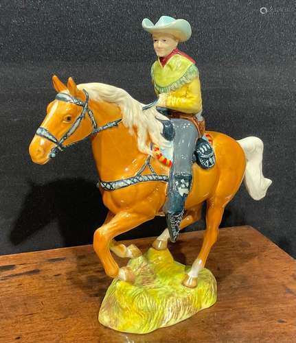 A Beswick model of a Canadian Mounted Cowboy on a galloping ...