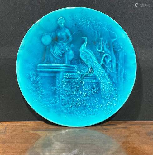 A Burmantofts Faience circular wall plaque, decorated in low...