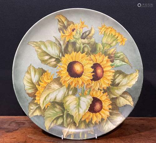 An Aesthetic Movement circular charger, painted by F Cridlan...