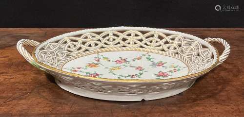 A Bristol reticulated two handled basket, the field painted ...