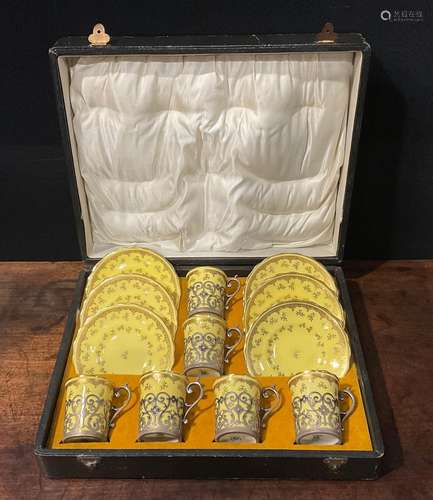 A set of six Coalport coffee cans and saucers, gilt floral f...