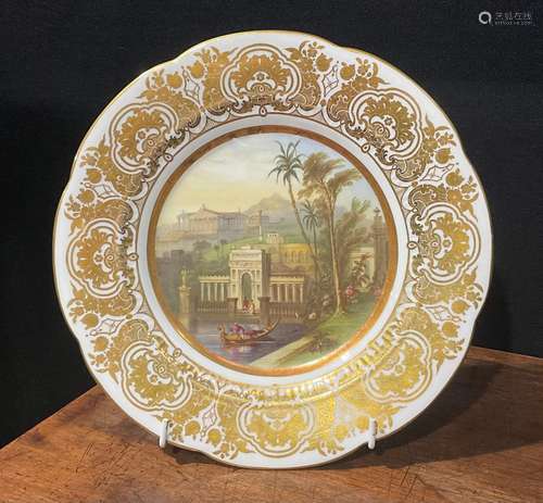 A shaped circular cabinet plate, probably Coalport, the fiel...