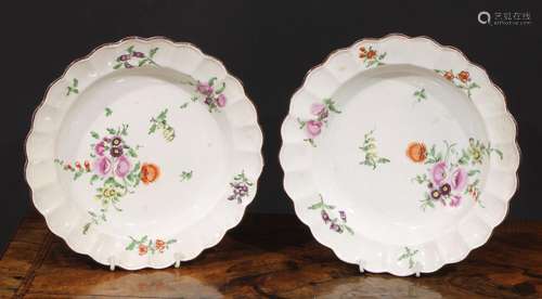 A pair of Worcester shaped circular plates, painted in polyc...