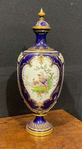 A Royal Worcester ovoid pedestal vase and cover, in the mann...