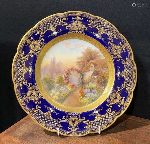 A Royal Worcester shaped circular cabinet plate, painted by ...