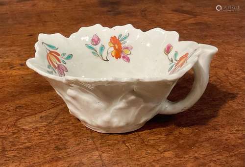 A Worcester butter boat, moulded with overlapping geranium l...