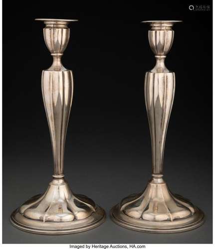 A Pair of Silver Candlesticks 12 x 5-3/4 x 5-3/4 inches (30....