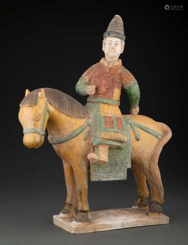 A Chinese Polychrome Ceramic Court Official on Horse, 16-1/4...