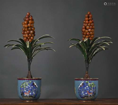 A pair of cloisonne potted landscape inlaid with treasure