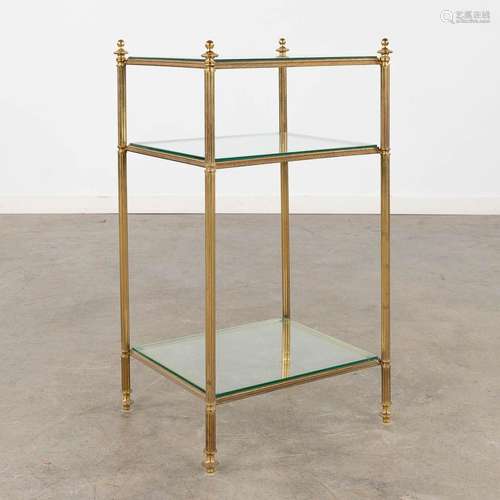 A two-tier side table, brass and glass in the style of Maiso...