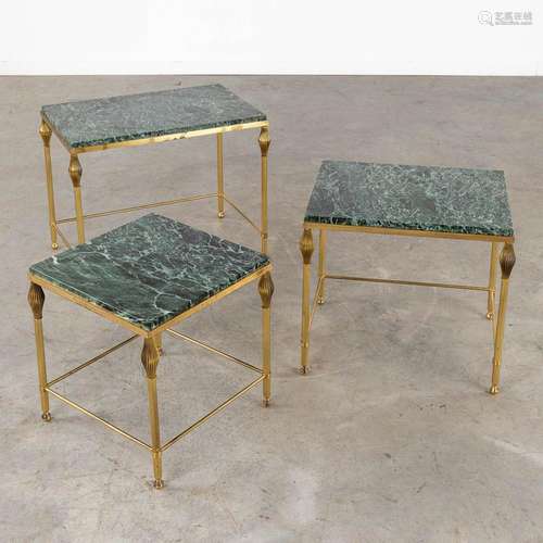 A three-piece set of nesting tables, gilt metal and a green ...