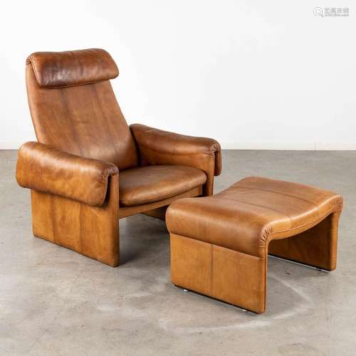 A mid-century lounge chair with ottoman, leather. (D:86 x W:...