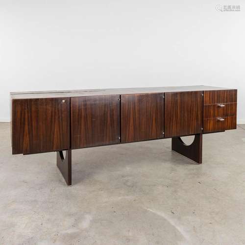 A mid-century sideboard with rosewood veneer, probably made ...