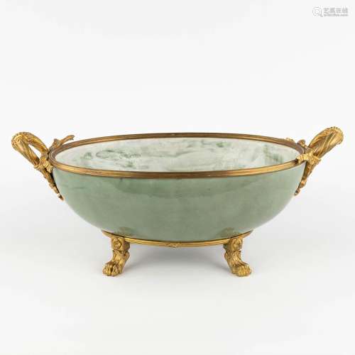 A large bowl mounted with gilt bronze. Glazed stoneware. (D:...