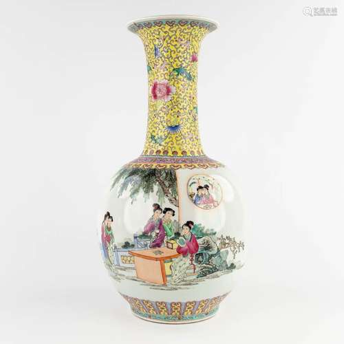 A large Chinese vase decorated with ladies in the garden. 20...