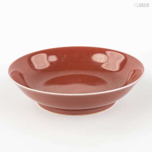 A Chinese bowl with monochrome red glaze, marked Qianlong. 1...