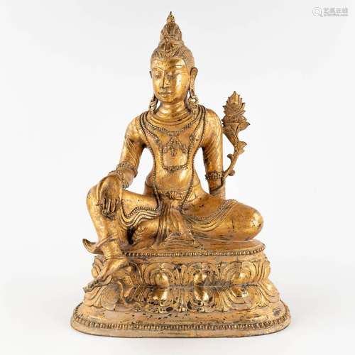 A sculpture of 'Green Tara', gilt bronze, 19th/20th C. (W:34...