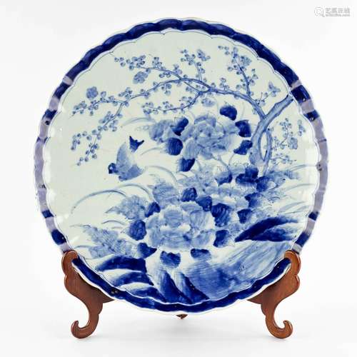 A large plate, Japanese porcelain, blue-white decor of fauna...