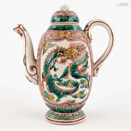 A teapot with a Famille Verte relief decor, probably Chinese...